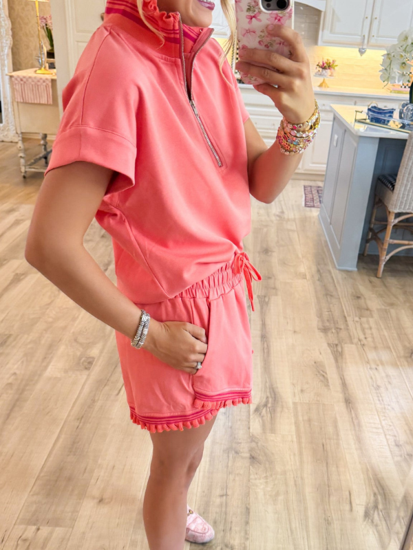 Coral ruffle trim top
